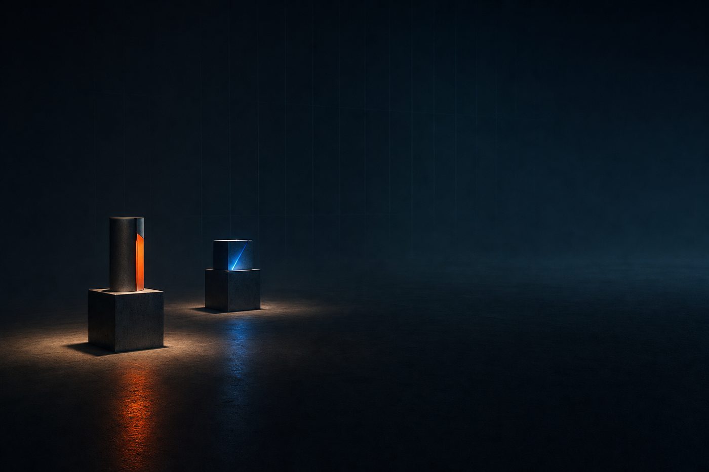 Two finished objects on plinths in an otherwise empty studio floor
